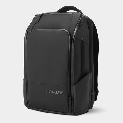 Nomatic Travel Pack 20L expandable carry-on backpack in black - front angle view showing briefcase-to-backpack convertible design#color_black